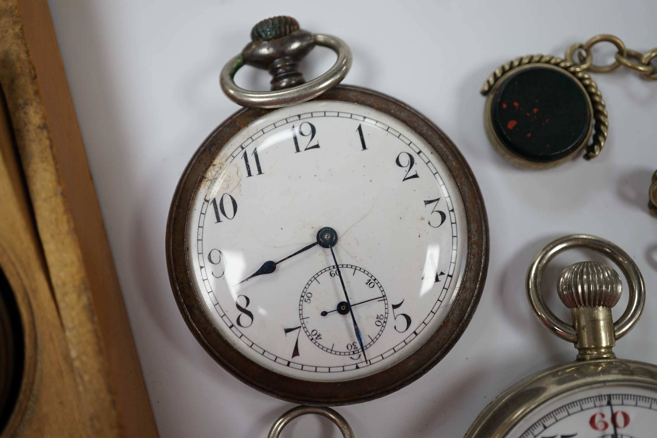 A Victorian silver open faced pocket watch, a silver fob watch, one other base metal pocket watch and a metal cased Lemania GPO stop watch, together with a base metal albert with spinning fob.